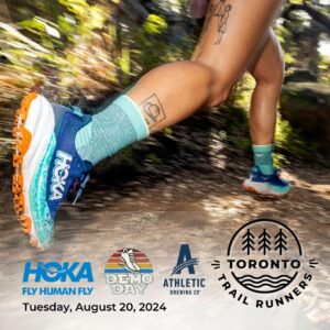 A photo of a runner wearing Hokas and running through the trails.